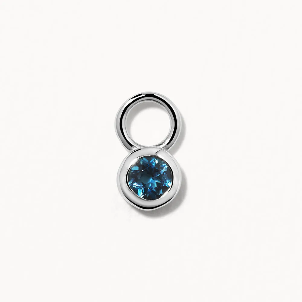 Blue Topaz Circle Charm in Silver