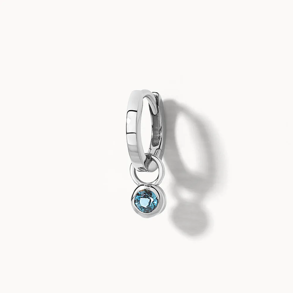 Blue Topaz Circle Charm in Silver